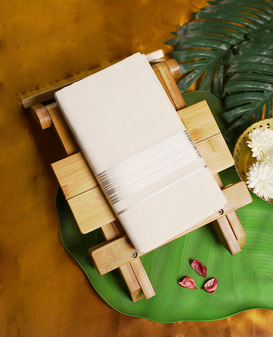 Elegant off white colour handloom cotton double dhoti with a sleek silver zari border, offering timeless style and comfort, Perfect for weddings, festive occasions, and traditional celebrations