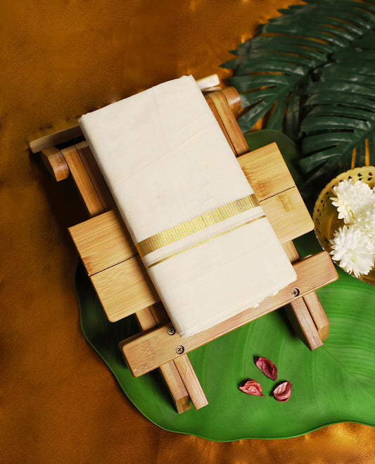 Classic ivory white pure cotton dhoti featuring a sleek golden zari border, crafted for effortless elegance, breathable comfort, and traditional style.