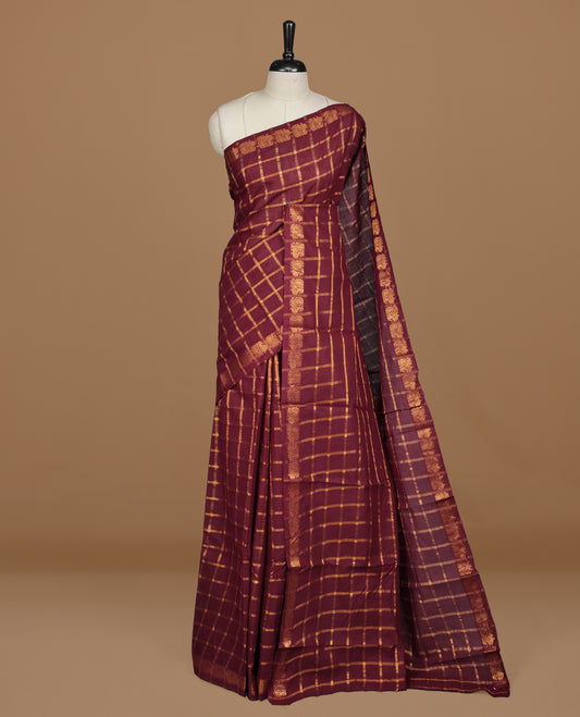 Maroon colour Sungudi cotton saree featuring Gold zari Check pattern on body, Gold zari Peacock design on Self colour border, paired with matching blouse piece.