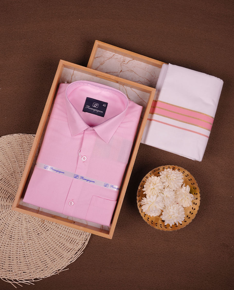 Light Pink Colour shirt paired with a matching dhoti, finished with a Pink and gold border.