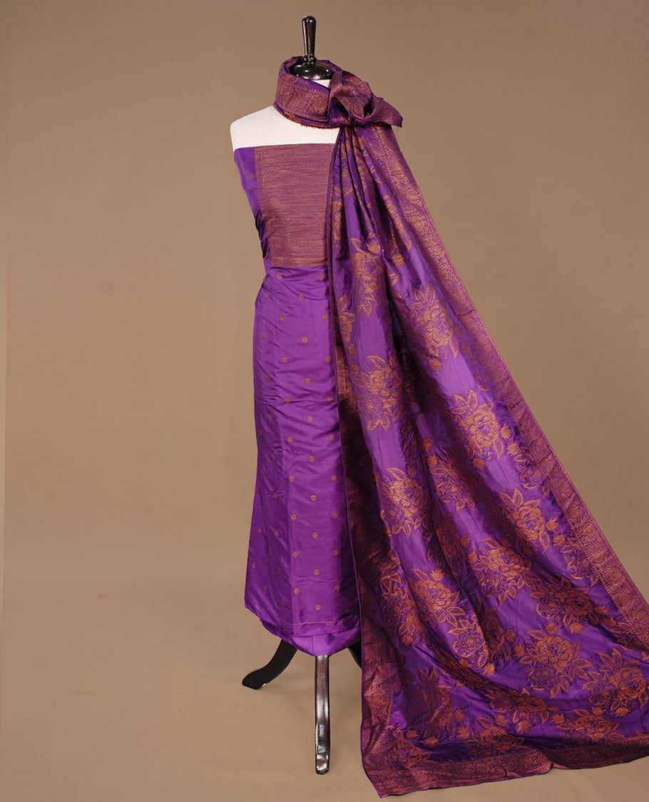 Purple colour churidhar material featuring Antique zari motifs on body, paired with matching bottom and Dupatta.