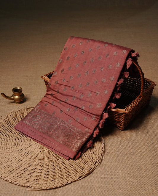 Muted brown colour semi tussar silk saree featuring elegant Antique zari motifs across the body, designed with a subtle borderless zari finish for a sophisticated traditional look. Paired with a matching blouse piece.
