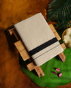Off white colour cotton dhoti with a bold black border for a refined traditional look, Soft, breathable, and perfect for weddings, rituals, or everyday ethnic wear.