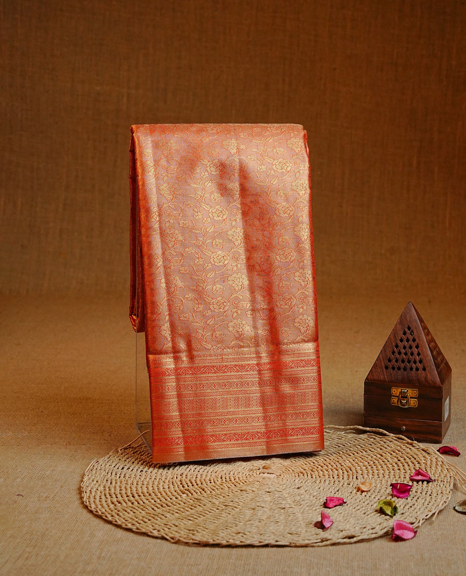 Orange & Gold colour Double shade Semi tissue silk saree featuring self color kodi pattern on body, self colour with traditional border, paired with matching.