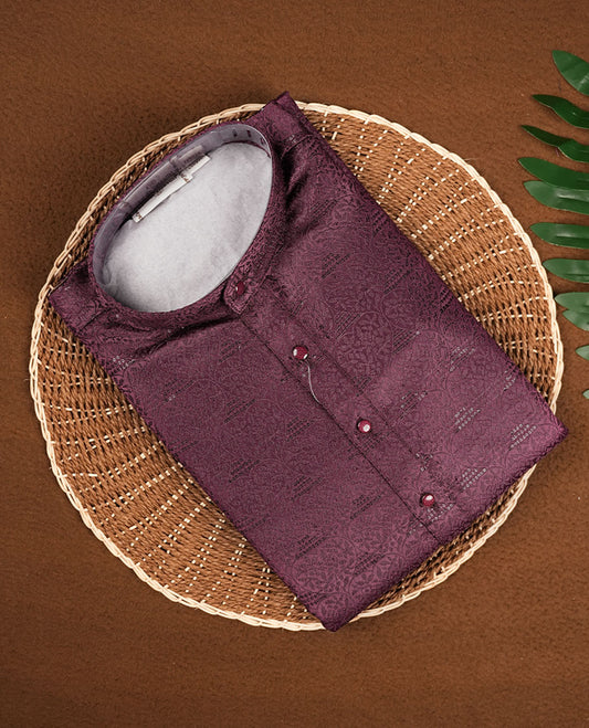 Burgundy colour mens kurta featuring elegant self colour embroidery across body & Crafted in a refined style with full sleeves, offering a perfect blend of tradition.