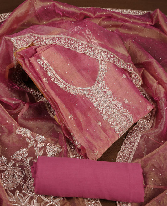 Onion pink colour churidar set with stone and thread embroidery and detailing, paired with matching pant and dupatta.