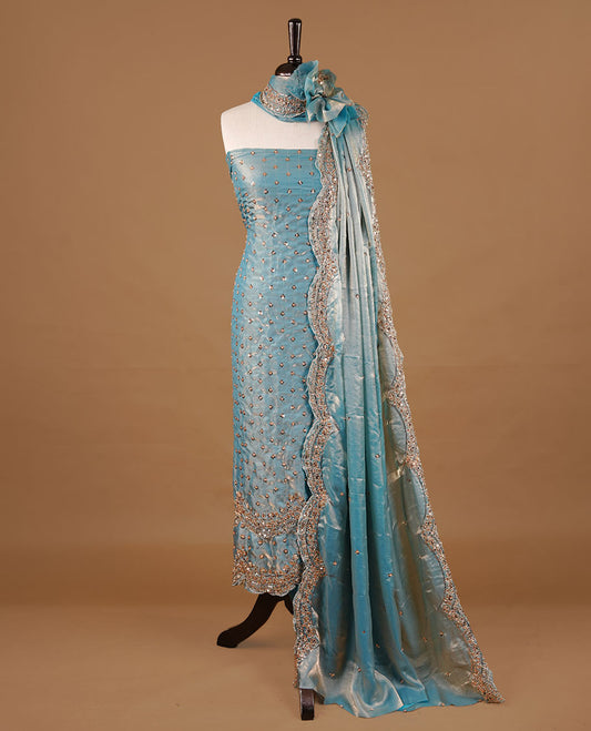 Aqua blue  colour churidhar material featuring cut beads and sequins work on the body, paired with a matching unstitched bottom and worked dupatta.