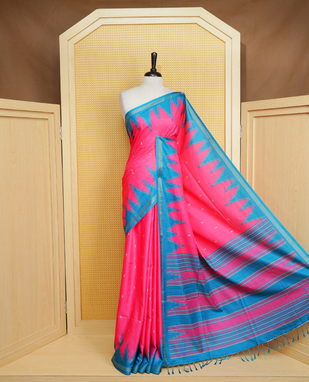 Rose Berry and Peacock Colour Kattan silk saree featuring buttas all over the body, a temple-designed border &  a contrasting striped pallu with tassels. Paired with a matching contrast-striped blouse piece.