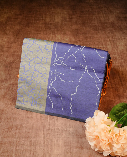 Purple blue colour Polycotton Saree adorned with White & blue abstract prints on the body, complemented by a printed pallu and matching printed blouse piece.