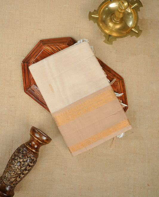 Cream colour chettinad cotton saree Featuring Elegant plain on body, complemented by self colour with zari border, comes with matching blouse piece.
