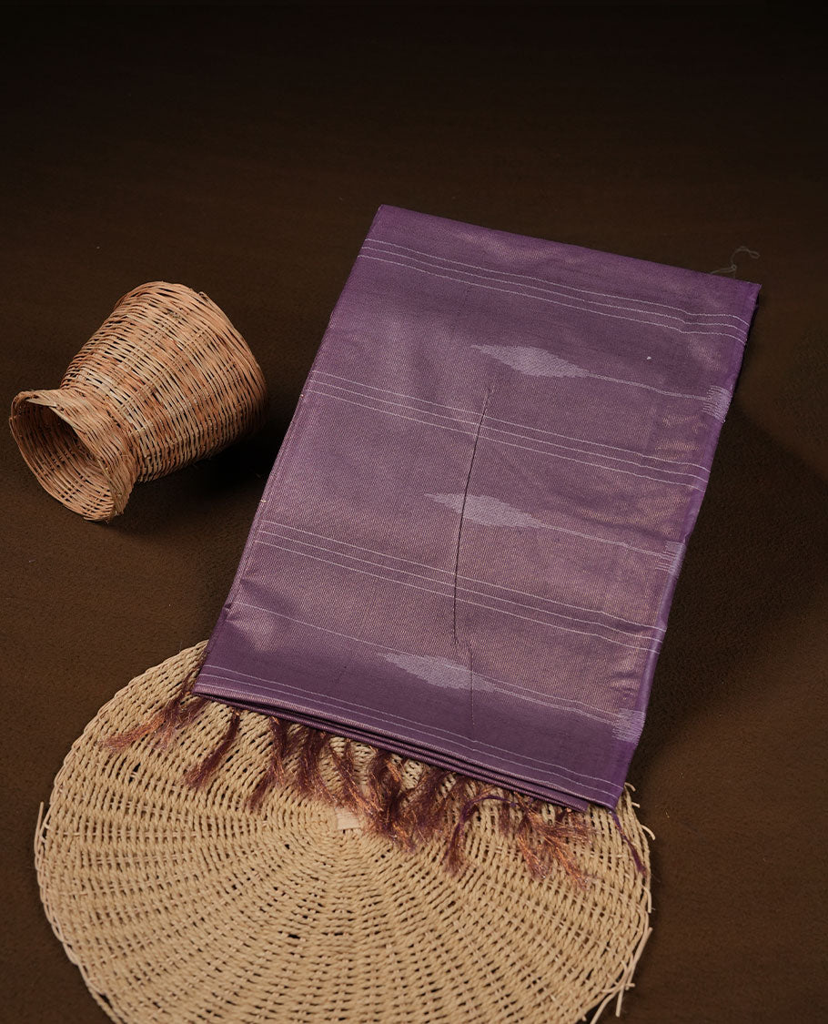 Purple colour semi jute saree highlighting gold zari stripped body with white motifs, without border and paired with matching blouse.