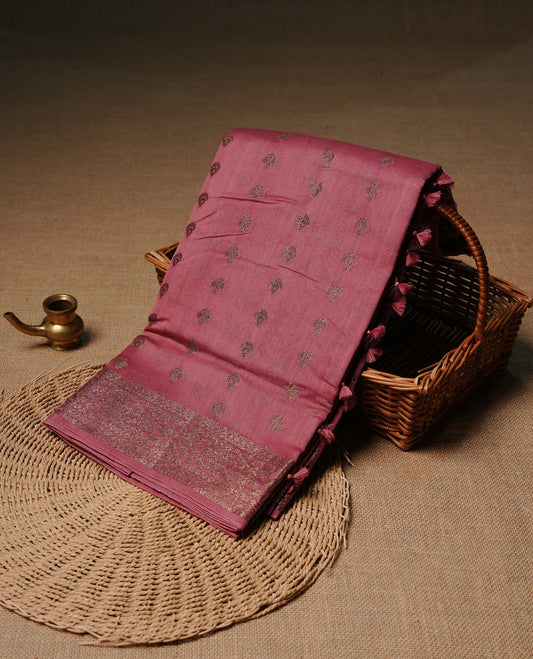 Mauve colour semi tussar silk saree featuring elegant Antique zari motifs across the body, designed with a subtle borderless zari finish for a sophisticated traditional look. Paired with a matching blouse piece.