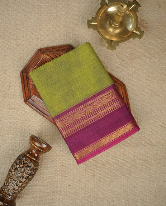 Lemon green colour chettinad cotton saree featuring elegant plain body, Contrast Magenta colour with Gold zari border, comes with matching blouse piece.