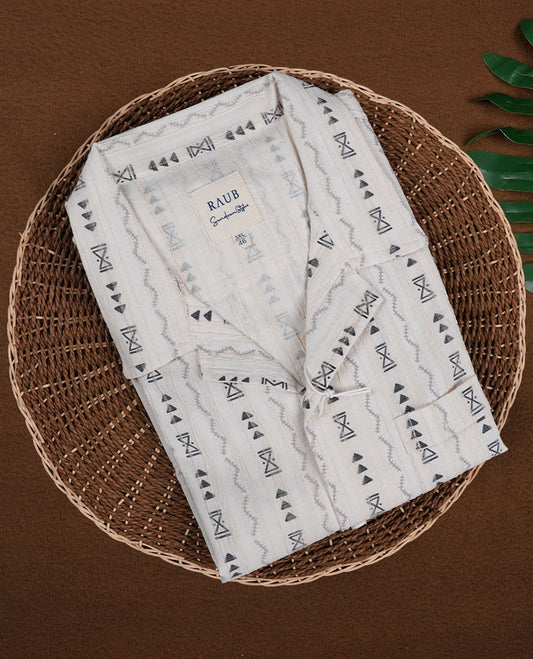 Off white colour shirt adorned with black geometric prints, Designed with a classic collar and short sleeves, it blends effortless style with everyday comfort.