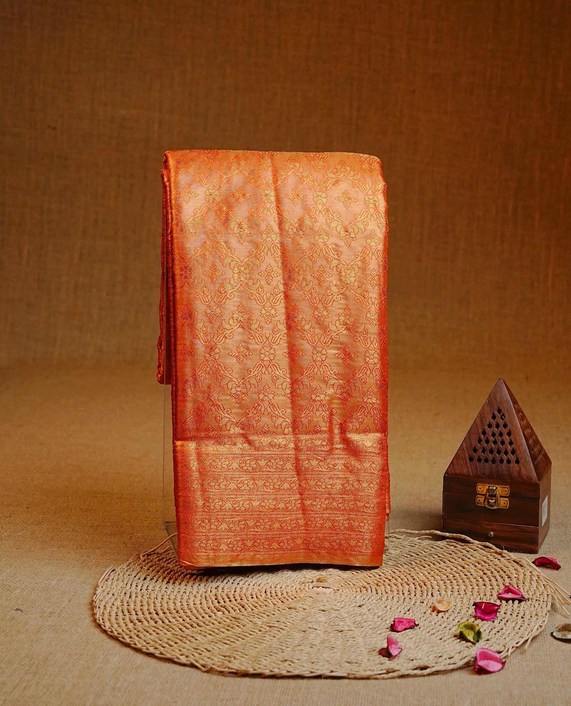 Orange & Gold colour Double shade Semi tissue silk saree featuring self color kodi pattern on body, self colour with traditional border, paired with matching.