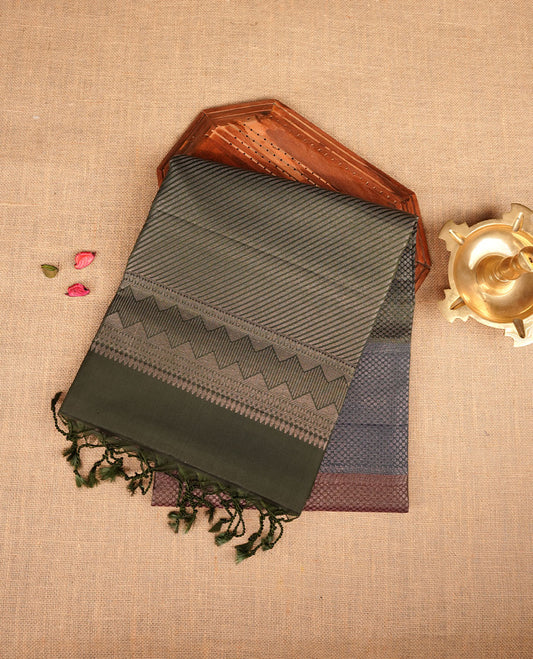 Green, Brown, blue colour soft silk saree featuring gold zari motifs on body, complemented by self colour with traditional border with tassel at pallu, paired with matching blouse piece.
