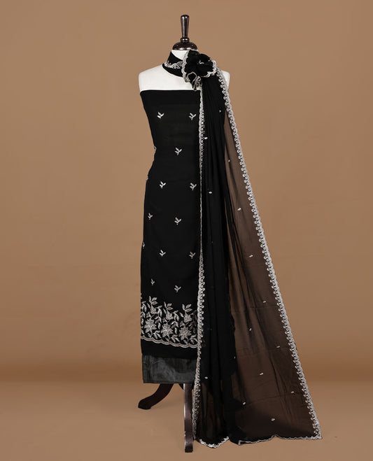 Black colour churidhar material featuring gold thread floral pattern on body, paired with matching bottom & dupatta.