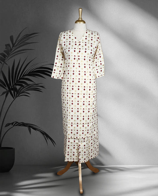 Off white colour cord set with subtle maroon and golden colour geometric prints, featuring a V neck top with a straight cut design and matching pants.