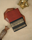 Maroon colour chettinad cotton saree featuring Elegant plain body, complemented by contrast Black colour with gold zari border, comes with matching blouse piece.