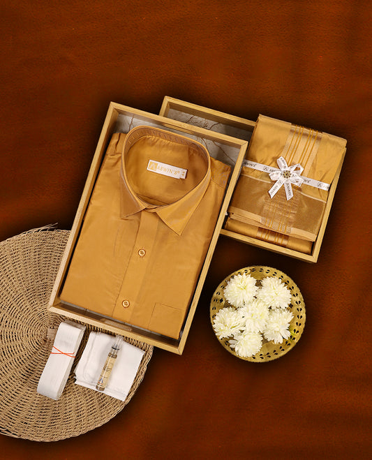 Gazel colour Aswin’s wedding set featuring a lustrous silk finish full sleeve shirt, paired with a matching dhoti and angavastram adorned with rich golden zari work, perfect for traditional celebrations.
