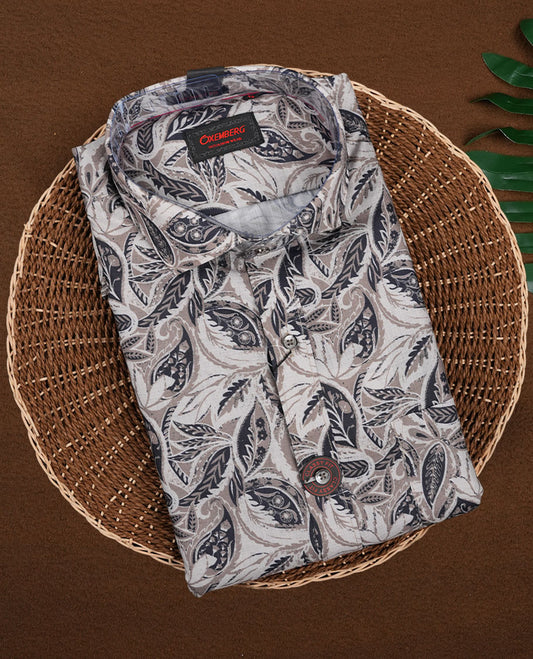 Olive green colour leaf printed full sleeve shirt featuring an all over hand drawn botanical design, Styled with a neat mandarin collar and button down front, offering a trendy and refreshing look.