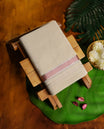 Beige colour cotton dhoti with a subtle peach & silver border, blending tradition with simplicity & Lightweight and comfortable, its perfect for rituals, cultural events, and festive celebrations.