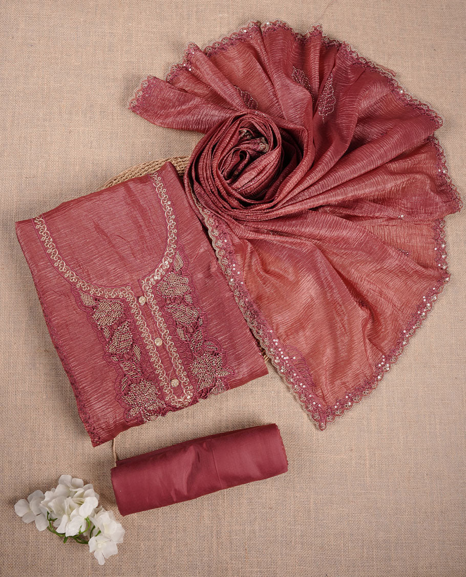 Mauve taupe colour churidar set with stone and thread embroidery and detailing, paired with matching pant and dupatta.