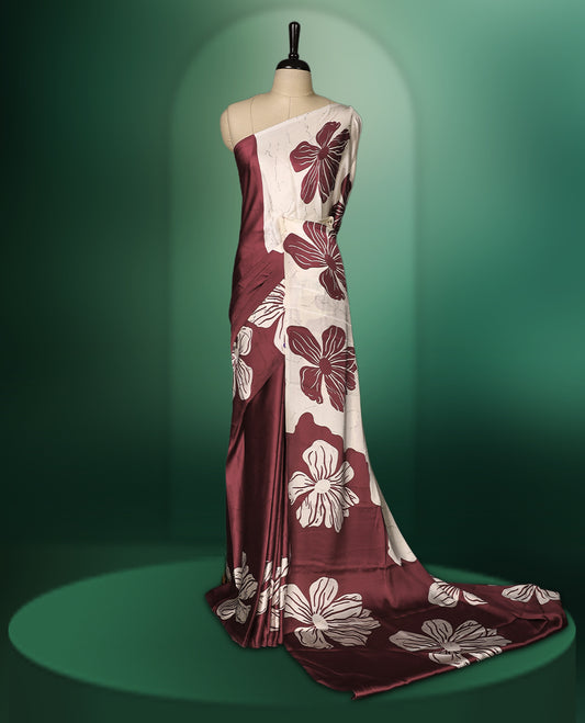 Deep Red and White semi modal saree featuring bold oversized floral prints across the body and pallu, crafted in a smooth fabric for a chic contemporary look, paired with a matching blouse.