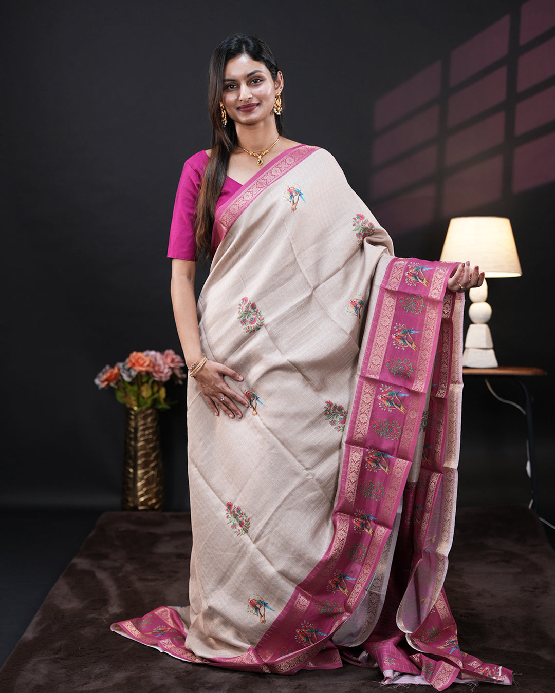 Cream Colour Moss chiffon saree featuring Double Parrot & Floral prints on the body, Pink Colour double border with peacock prints, and a contrast designed pallu, paired with a contrast designed blouse piece.