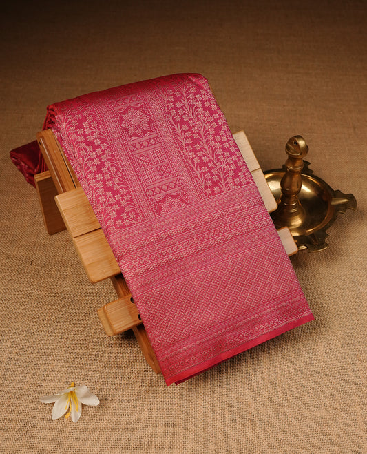 Maroon Pink Colour Wedding silk saree Featuring Gold Zari Pattern on Body, Finished with Self colour With Traditional border, Comes with Matching Blouse Piece.