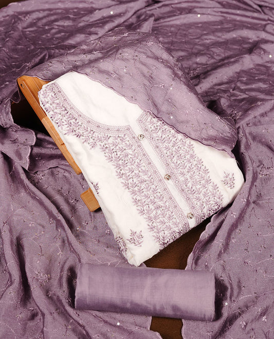 Ivory colour churidar material with lavender colour thread embroidery on the front panel, paired with a lavender matching dupatta and bottom.