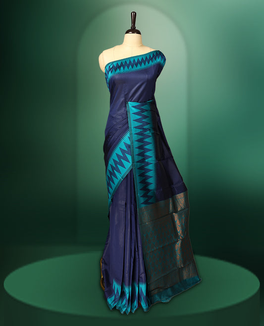 Navy blue colour saree adorned with bold turquoise zigzag woven patterns along the border and pallu, finished with a rich metallic woven design, paired with a matching blouse