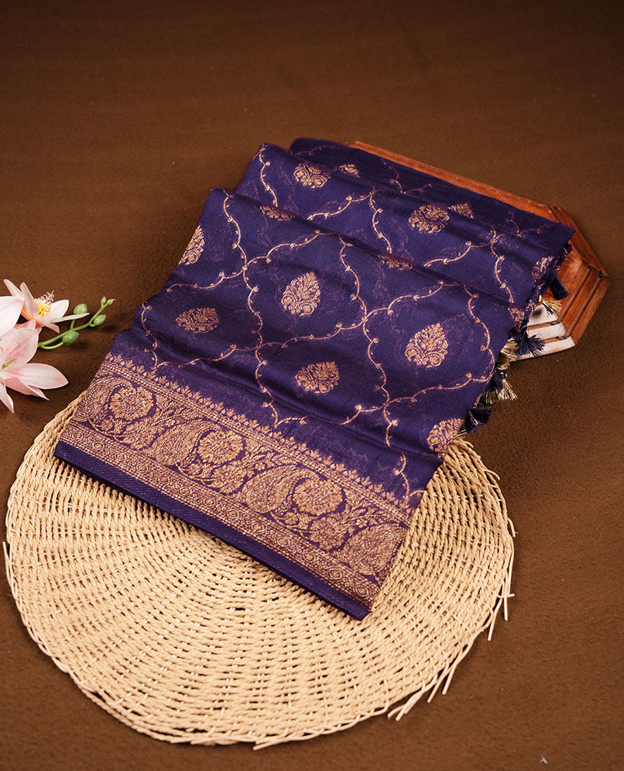 Purple colour semi Banaras saree with gold zari buta motifs, finished with a traditional gold zari border and pallu, paired with a matching blouse.