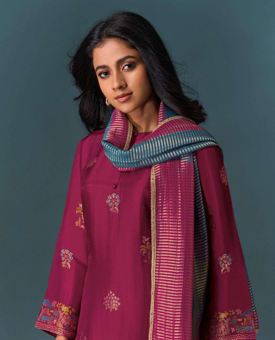 Deep maroon colour suit material with Olivia silk jacquard top featuring elegant digital prints, paired with classic silk bottoms, and completed with a silk jari lining dupatta highlighted by digital prints