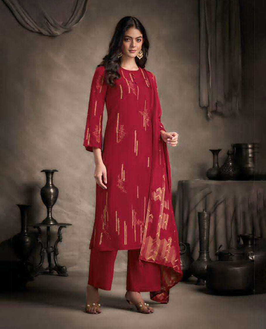 Red colour suit material with Rubina silk top adorned with elegant embroidery work, paired with luxurious satin bottoms, and completed with a muslin jacquard dupatta featuring rich woven detailing