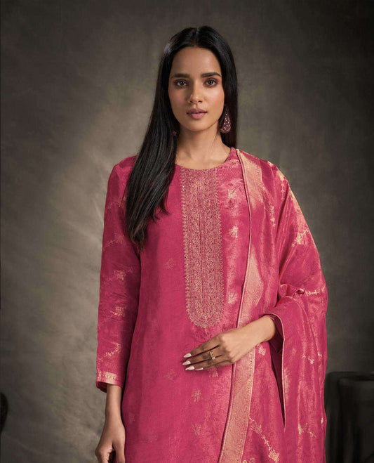 Pink colour suit material featuring an Akina silk jacquard top with delicate embroidery, paired with satin bottoms and completed with a matching Akina silk jacquard dupatta
