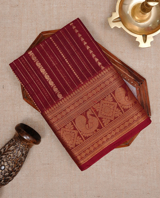 Red colour Chettinad cotton saree featuring Gold zari stripes on body, complemented by Self colour with Gold zari border, paired with matching blouse piece.