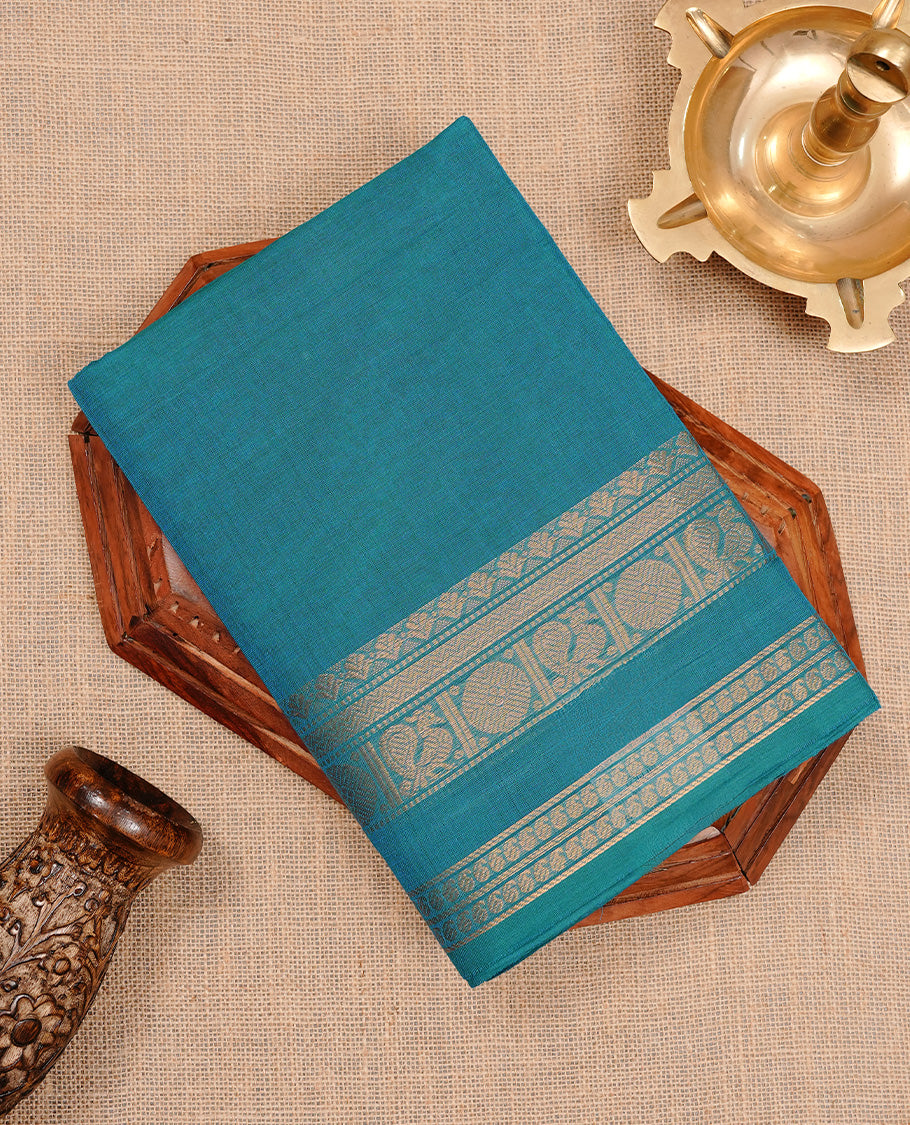 Aqua colour chettinad cotton saree featuring elegant plain body, complemented by self colour with zari border, paired with matching blouse piece.