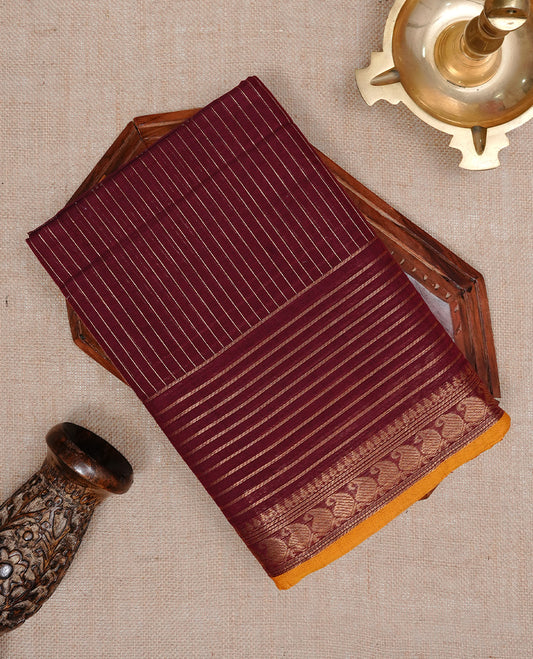Maroon colour Chettinad cotton saree featuring Gold zari stripes on body, complemented by Self colour with Gold zari border mustard piping, paired with matching blouse piece.