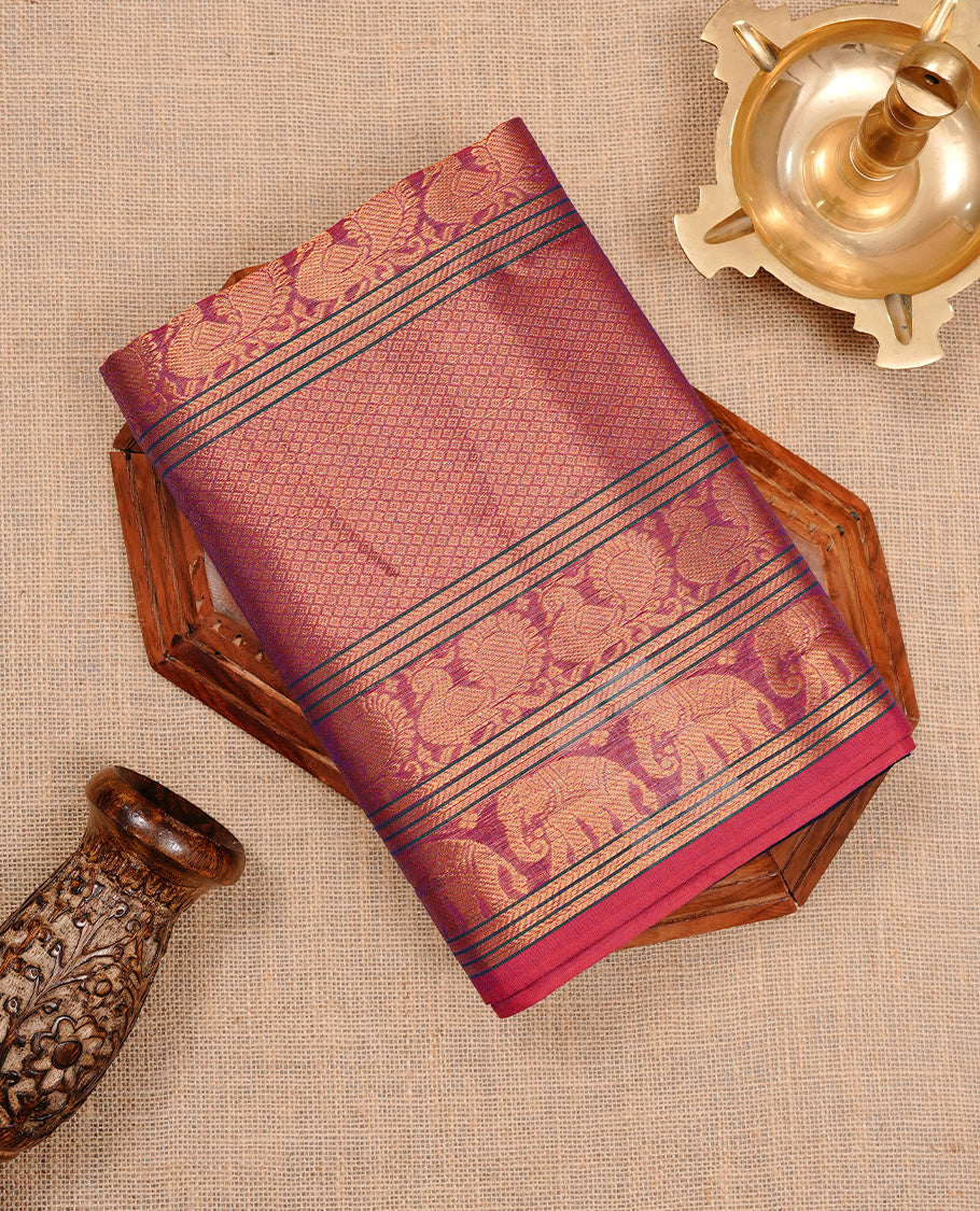 Navy blue colour chettinad cotton saree featuring Elegant plain body, complemented by magenta colour with traditional border, paired with matching blouse piece.