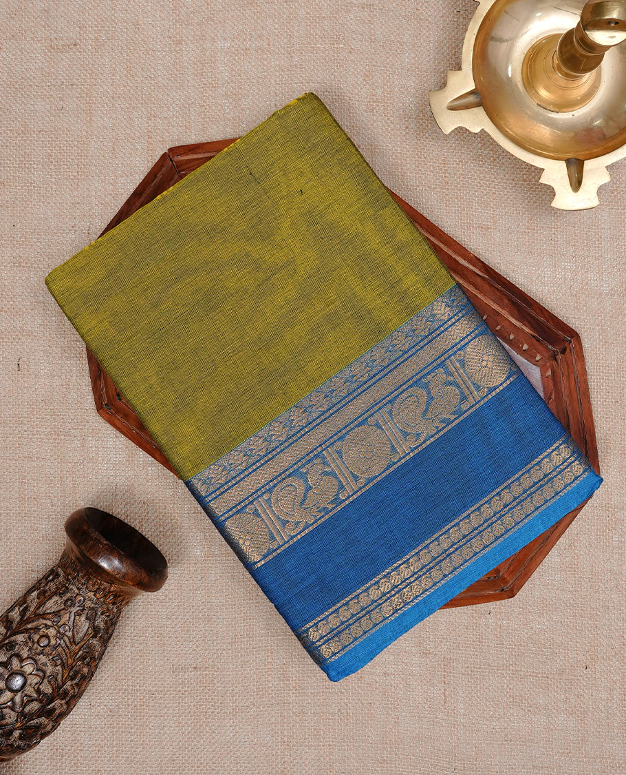 Olive colour Chettinad cotton saree featuring Elegant body, complemented by Contrast Blue colour with Gold zari border, paired with matching blouse piece.