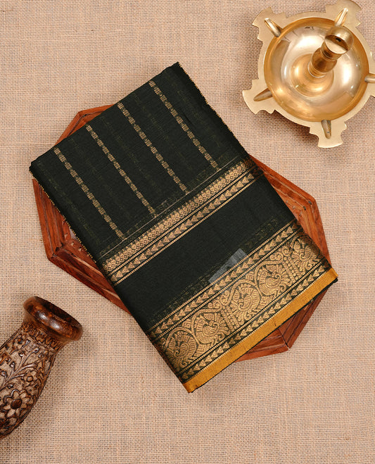 Dark green colour chettinad cotton saree featuring gold zari stripes on body, complemented by self colour with zari  mustard piping border, paired with matching blouse piece.