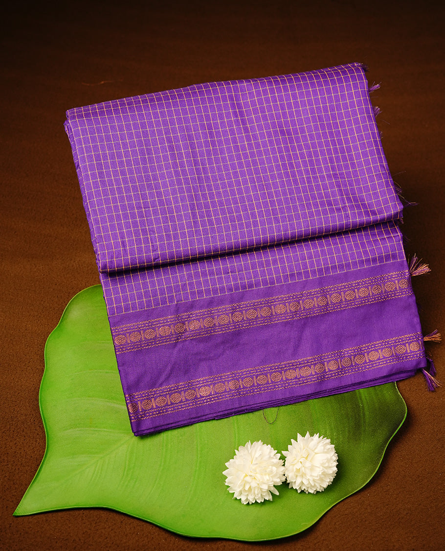 Indigo colour kalyani cotton saree featuring check pattern on body, highlighting self colour with simple gold zari border, paired with matching blouse piece.