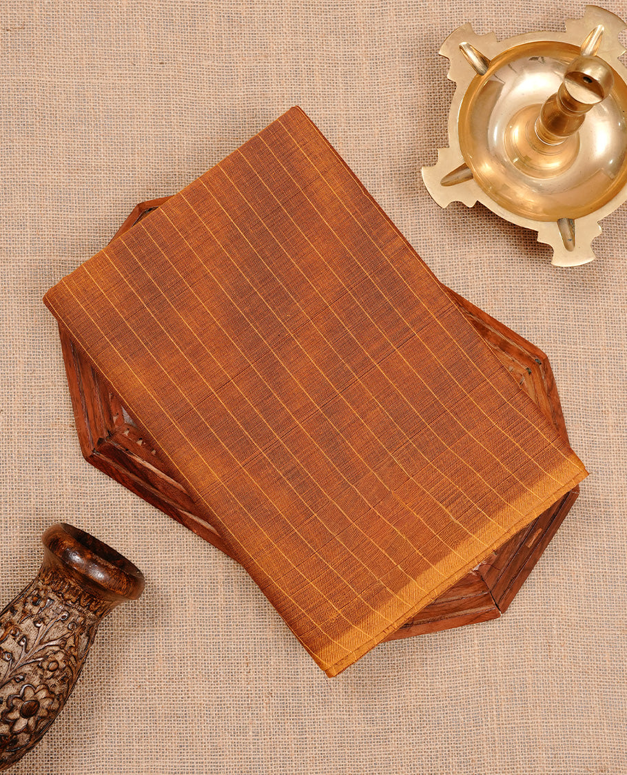 Mustard colour chettinad cotton saree featuring check pattern on body, complemented by self colour without border, paired with matching blouse piece.