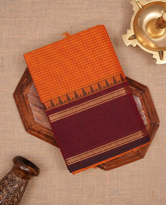 Tangerine colour chettinad colour featuring check pattern on body, complemented by maroon with zari border, paired with matching blouse piece.