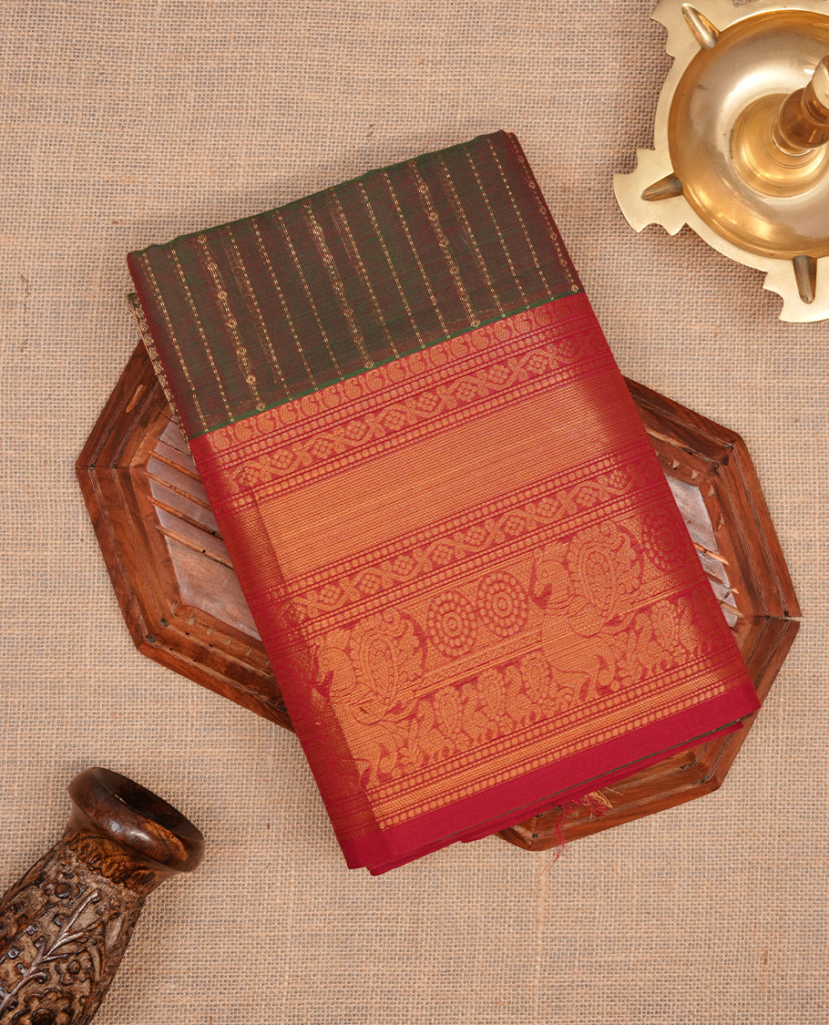 Green & red double shade colour chettinad saree featuring gold zari stripes on body, complemented by contrast Red colour with traditional border, paired with matching blouse piece.
