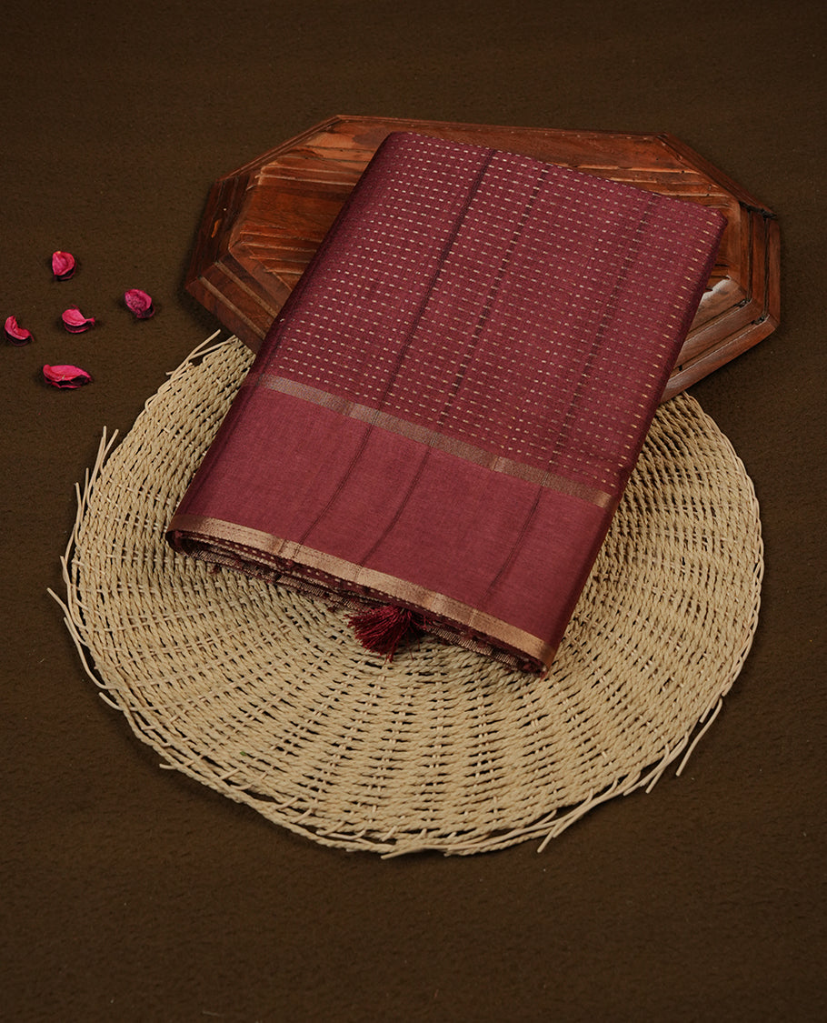 Brown colour semi tussar silk saree highlighting gold zari dotted stripes, self colour border and contrast dark brown pallu and comes with matching blouse piece.