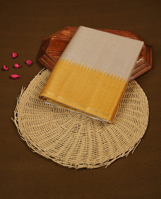 Beige colour semi tussar saree highlighting elegant plain body, contrast yellow colour border with gold zari box pattern, pallu and comes with matching blouse piece.