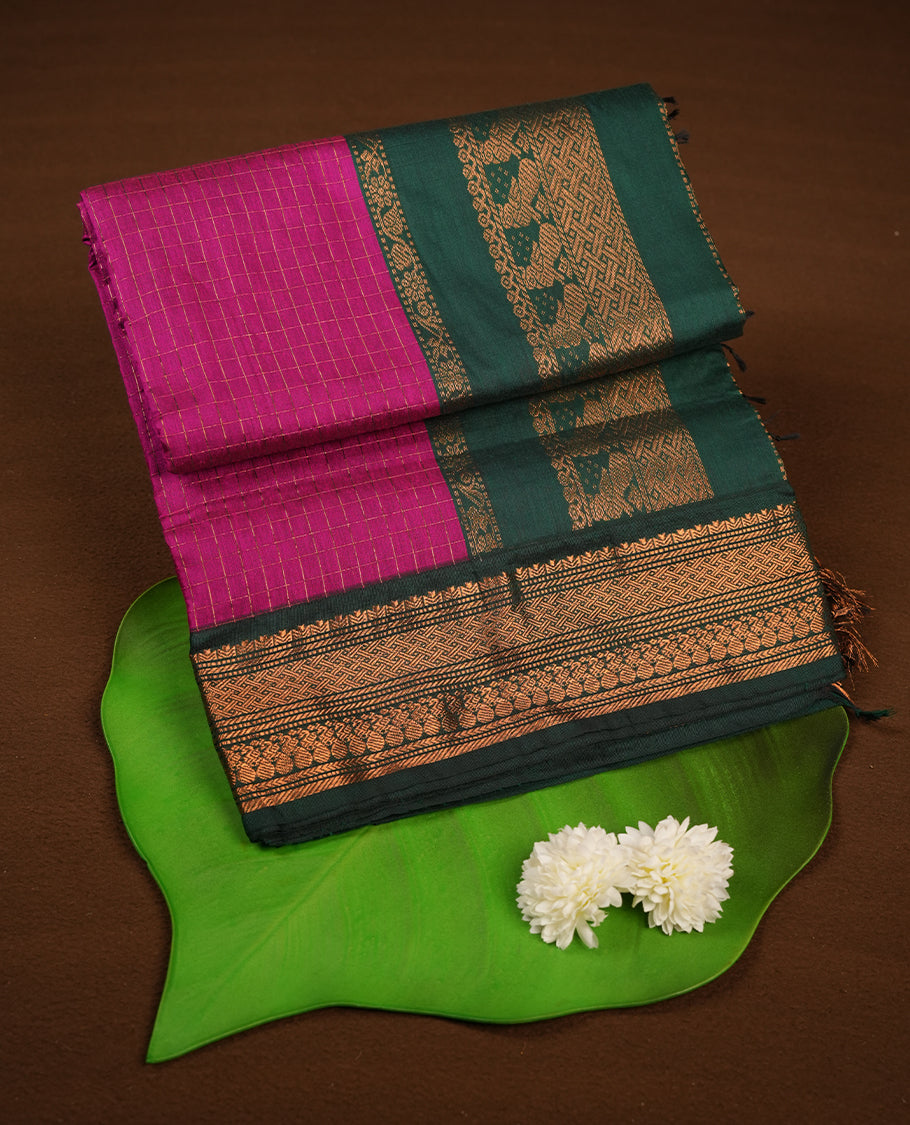 Magenta colour kalyani cotton saree featuring Antique zari check pattern on body, contrast Green colour border with antique zari pattern, paired with matching blouse piece.