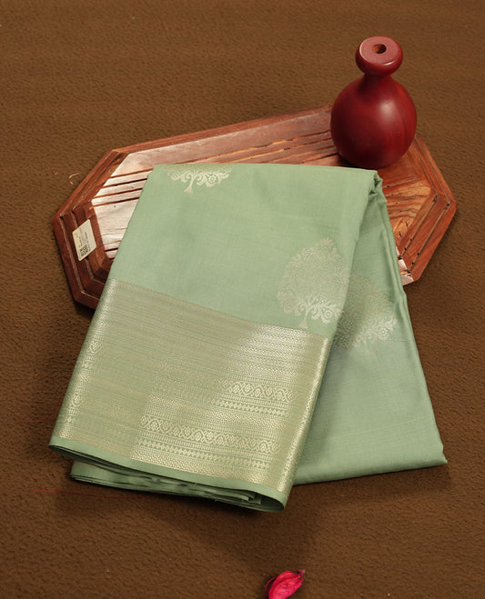 Pastel Mint colour semi soft silk saree featuring a self coloured golden textured patterned body, complemented by self coloured with gold traditional motifs on pallu & border and a matching blouse piece.